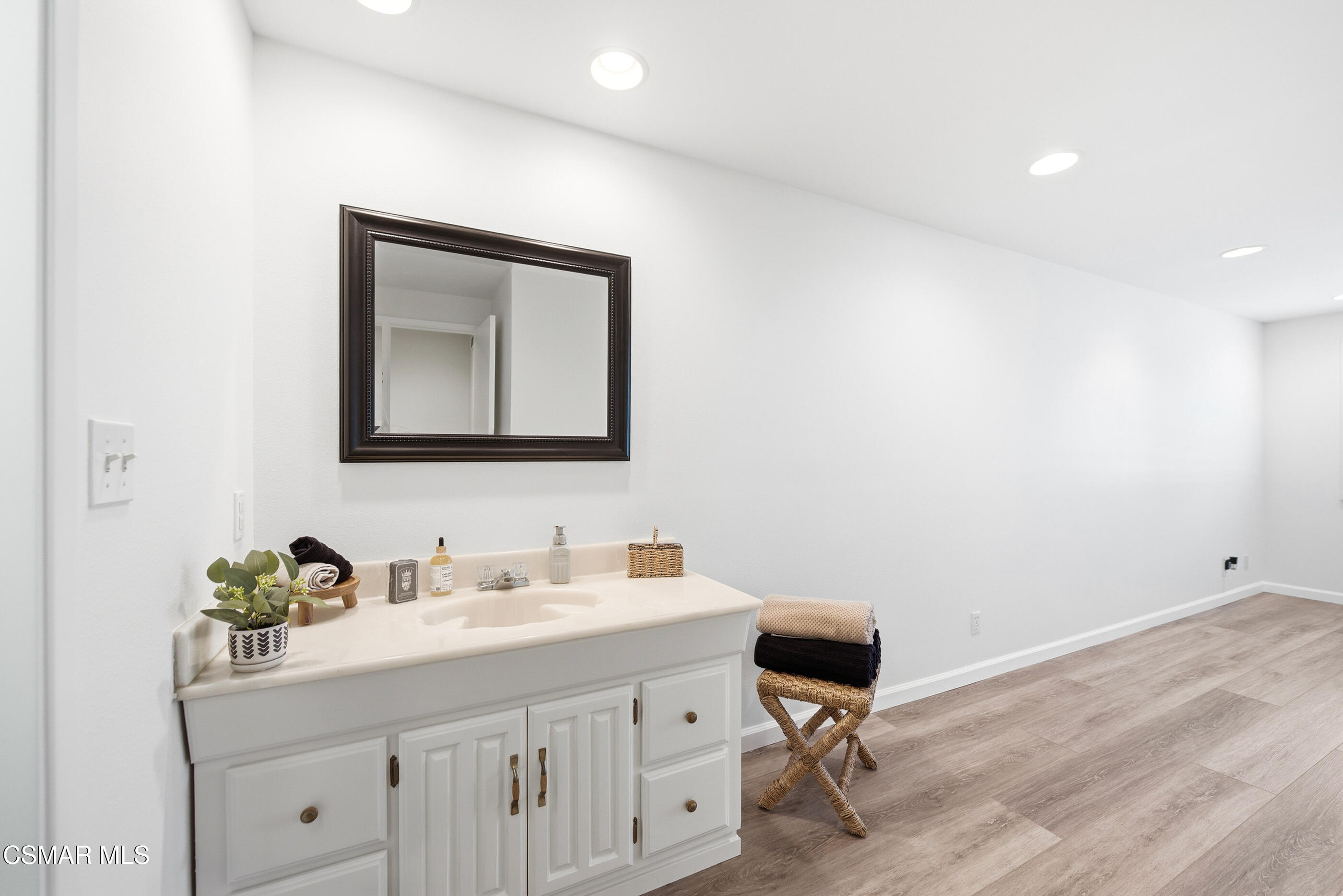 3598 Scofield Avenue Simi Valley, CA 93063 - Photo 51 of 86 a bathroom with a toilet sink and mirror