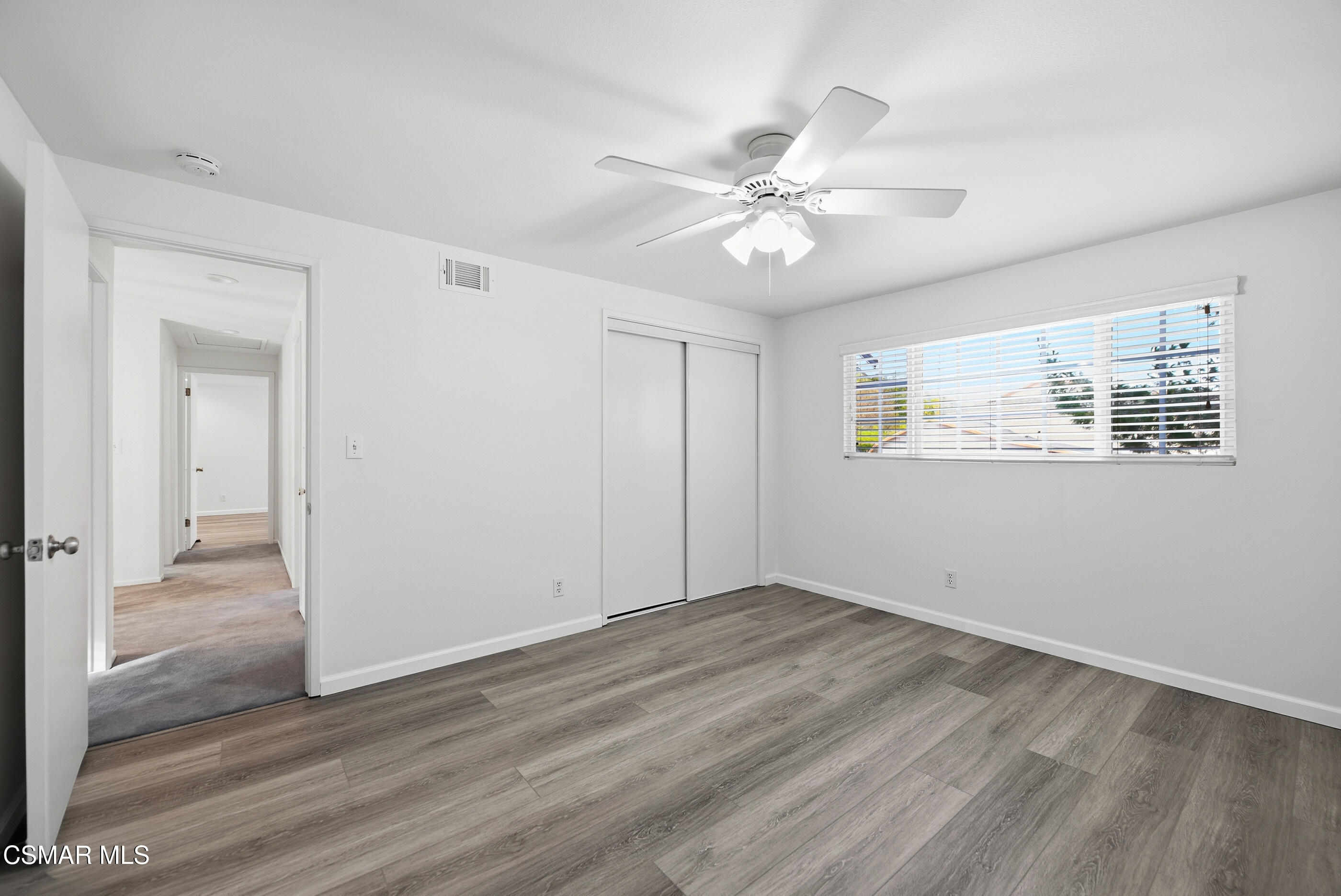 3598 Scofield Avenue Simi Valley, CA 93063 - Photo 54 of 86 a view of an empty room with wooden floor and a window