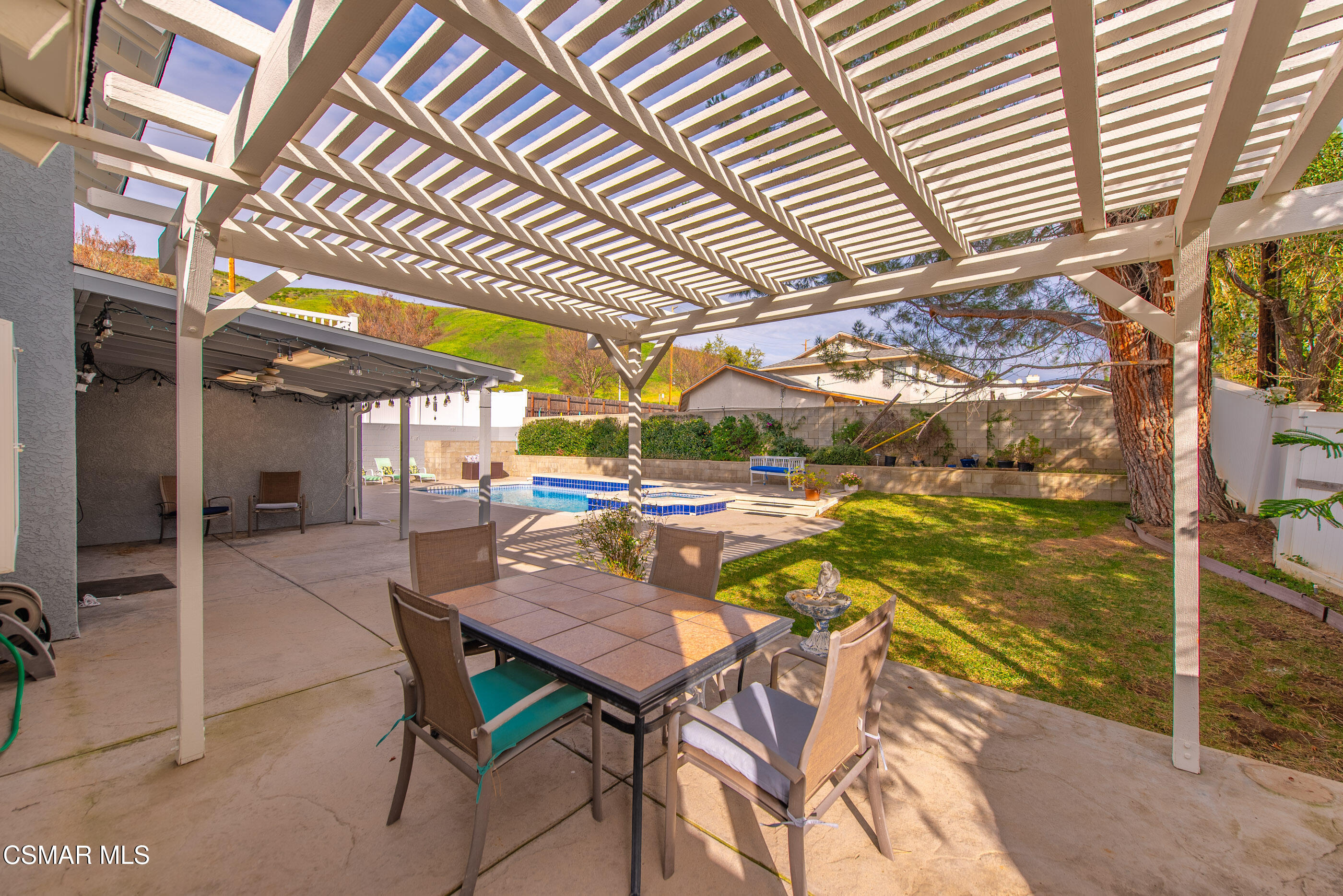 3598 Scofield Avenue Simi Valley, CA 93063 - Photo 61 of 86 a view of a patio with table and chairs with wooden floor and fence