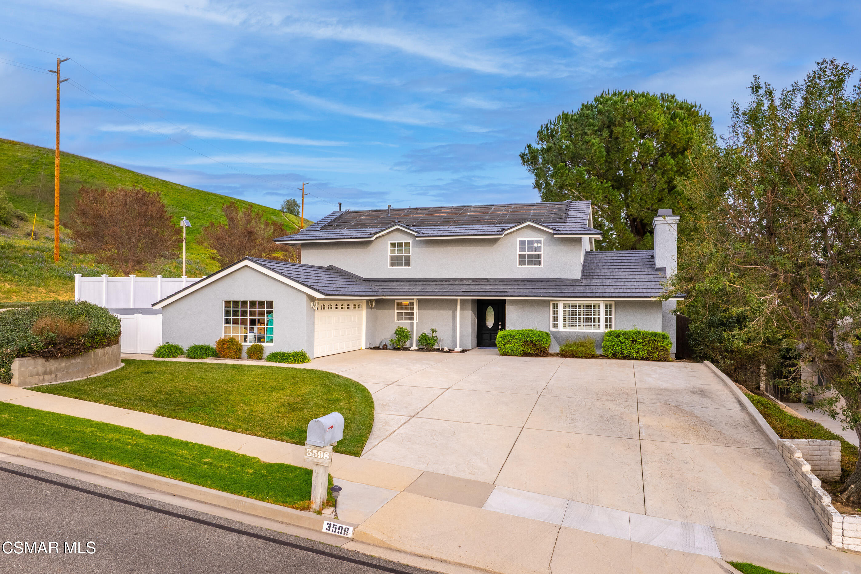 3598 Scofield Avenue Simi Valley, CA 93063 - Photo 76 of 86 a front view of a house with a yard