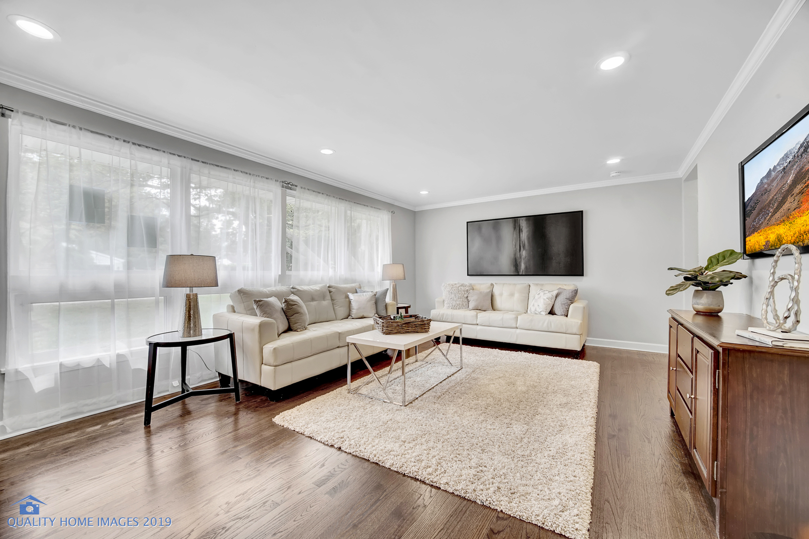 2416 Central Road Glenview, IL 60025 - Photo 3 of 17 a living room with furniture and a flat screen tv