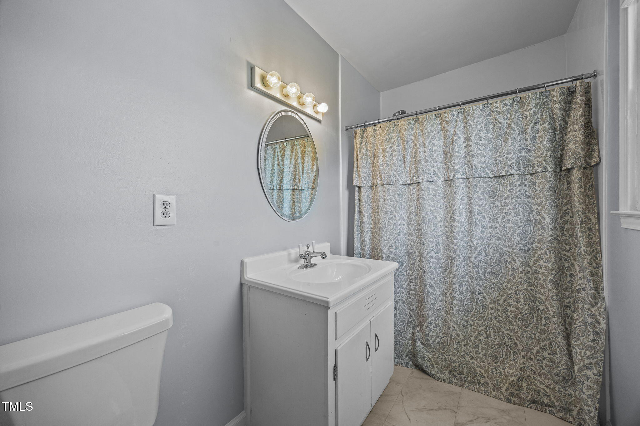 1500 Fairground Road Dunn, NC 28334 - Photo 11 of 31 a bathroom with a sink toilet and shower