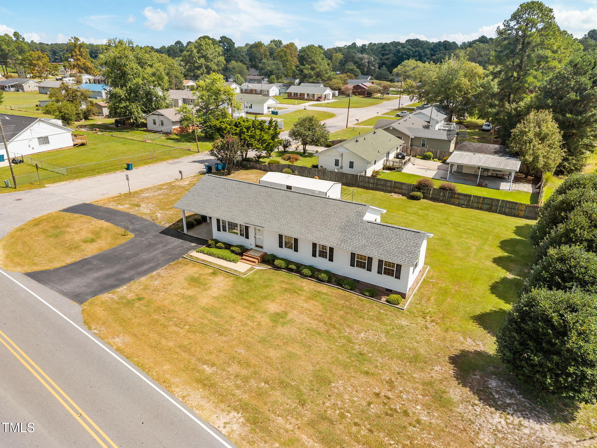 1500 Fairground Road Dunn, NC 28334 - Photo 2 of 31 a view of a swimming pool with a lake