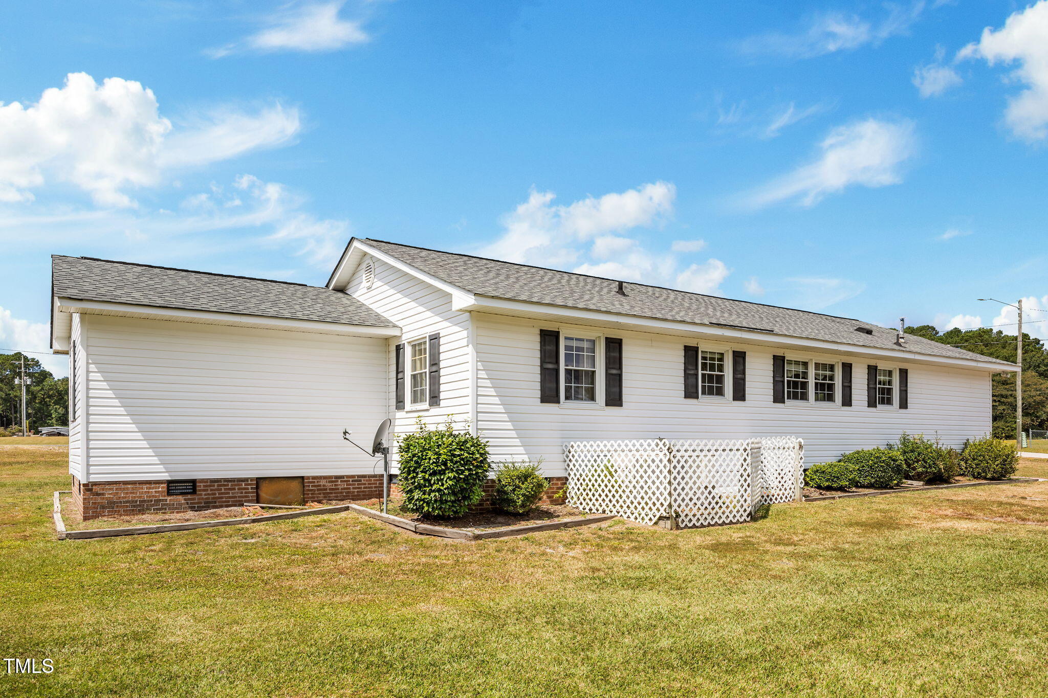 1500 Fairground Road Dunn, NC 28334 - Photo 22 of 31 a view of a house with a patio