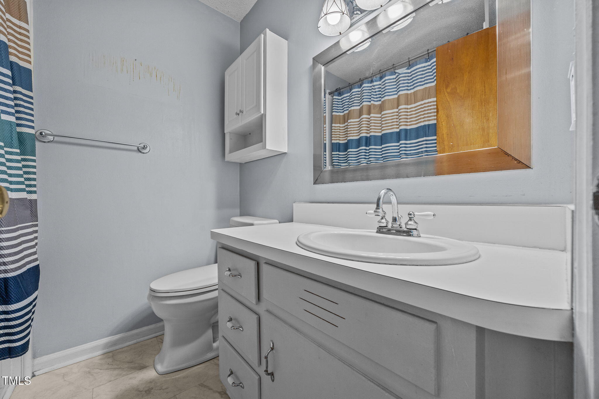 1500 Fairground Road Dunn, NC 28334 - Photo 8 of 31 a bathroom with a sink toilet and mirror