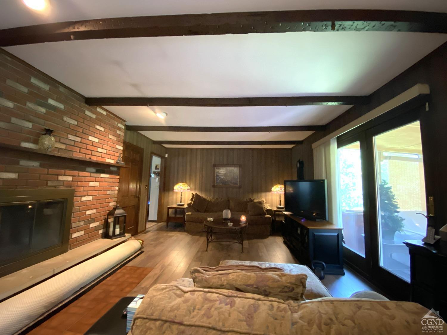 541 Church Road Hudson, NY 12534 - Photo 11 of 21 a living room with furniture and a large window