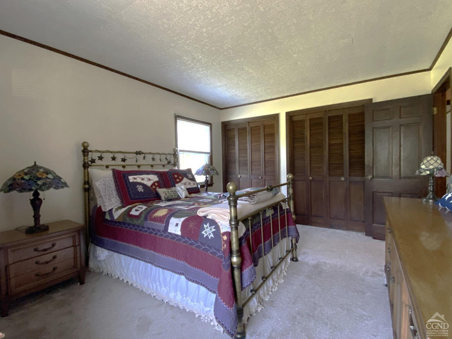 541 Church Road Hudson, NY 12534 - Photo 15 of 21 a bed room with a bed and a chair