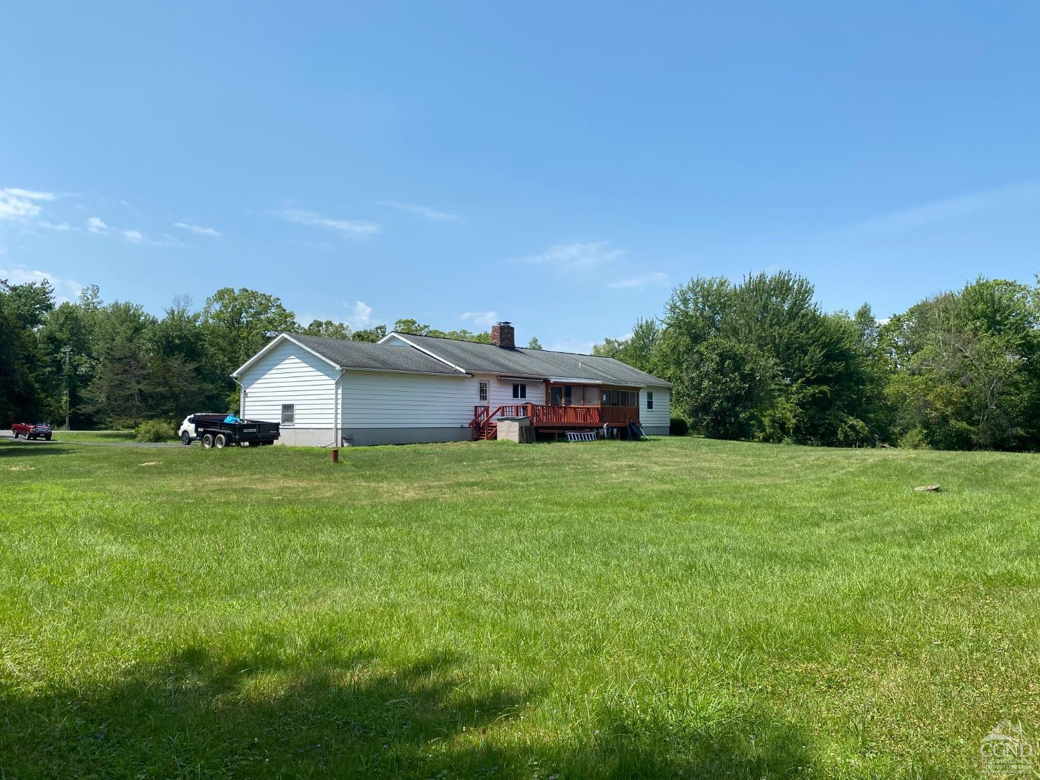 541 Church Road Hudson, NY 12534 - Photo 19 of 21 a front view of a house with a yard and trees