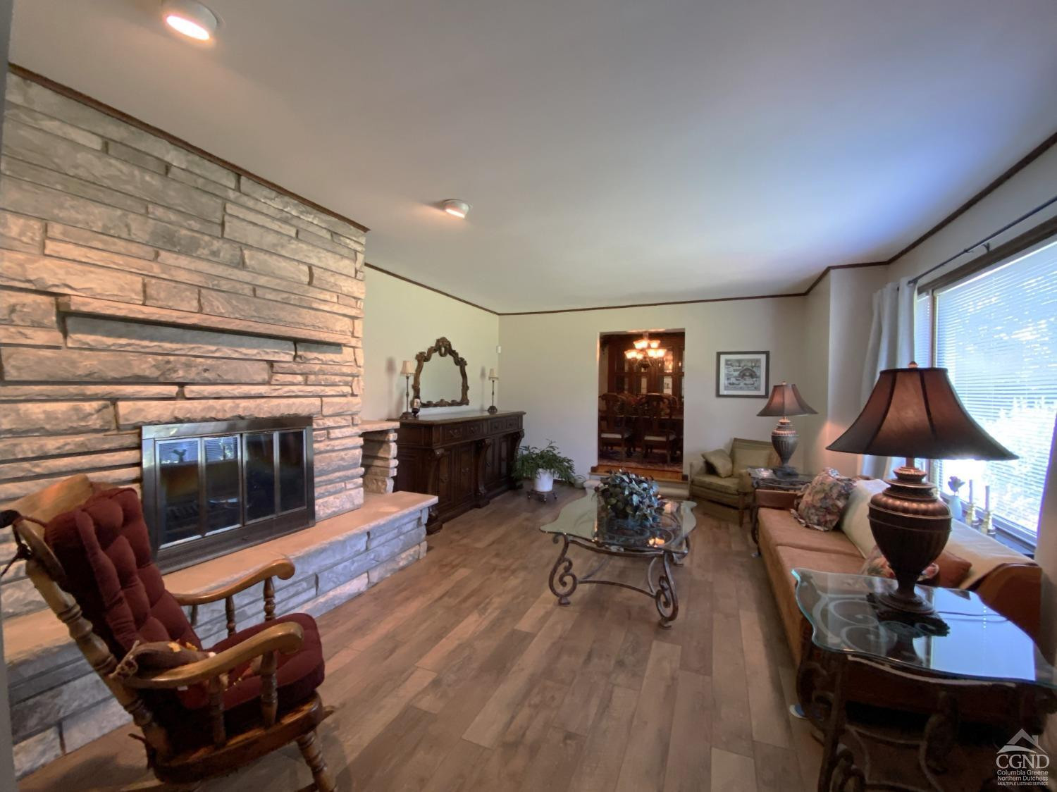 541 Church Road Hudson, NY 12534 - Photo 5 of 21 a living room with furniture and a fireplace