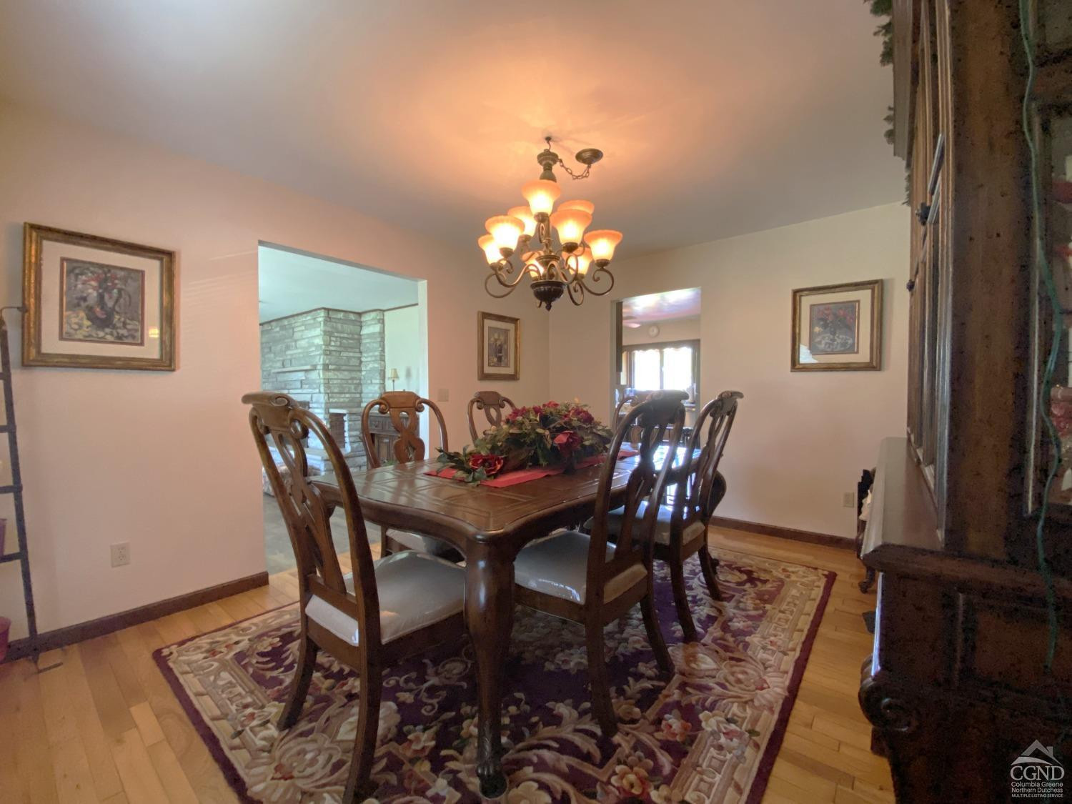 541 Church Road Hudson, NY 12534 - Photo 7 of 21 a view of a dining room with furniture and chandelier