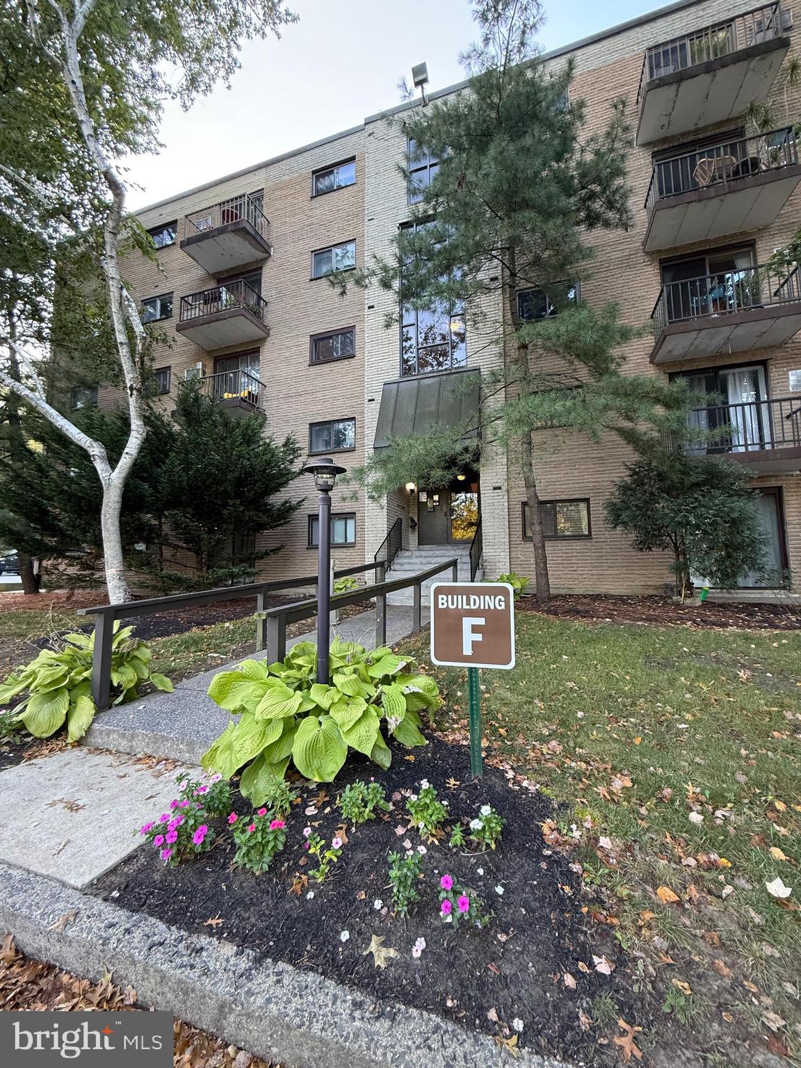 a backyard of a house with lots of green space and fountain view