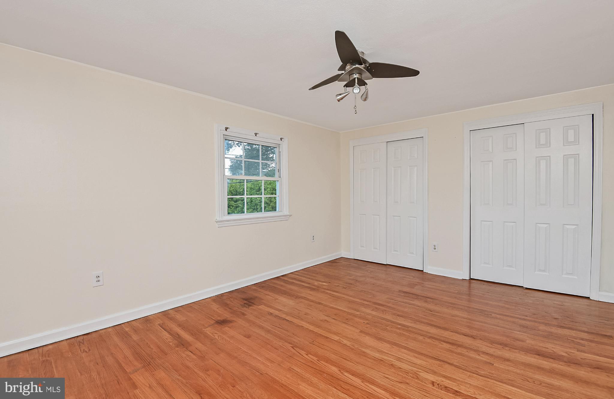 15 Constance Drive Hamilton, NJ 08620 - Photo 17 of 29 a view of empty room with wooden floor and ceiling fan
