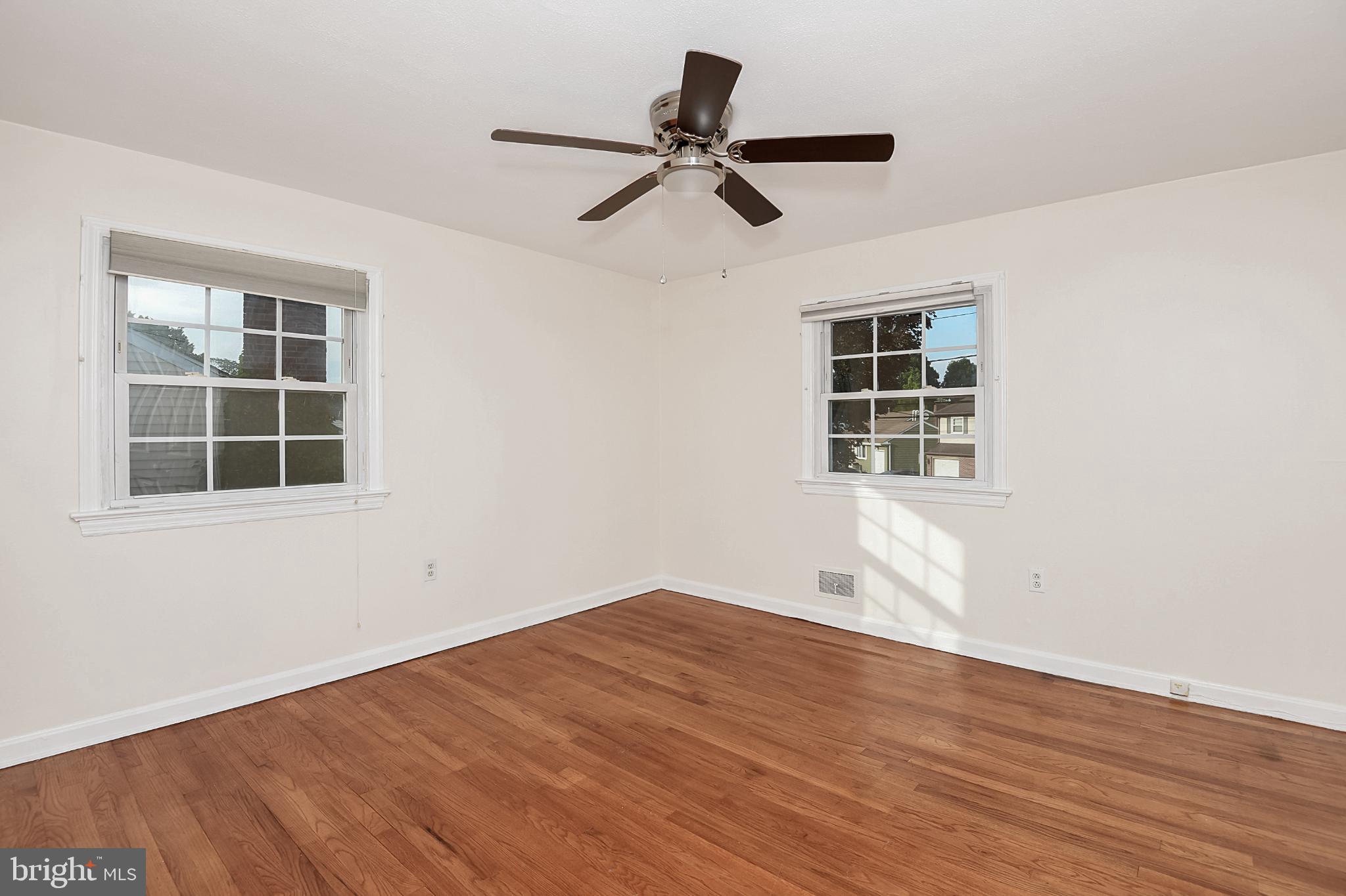 15 Constance Drive Hamilton, NJ 08620 - Photo 19 of 29 a view of empty room with wooden floor and windows