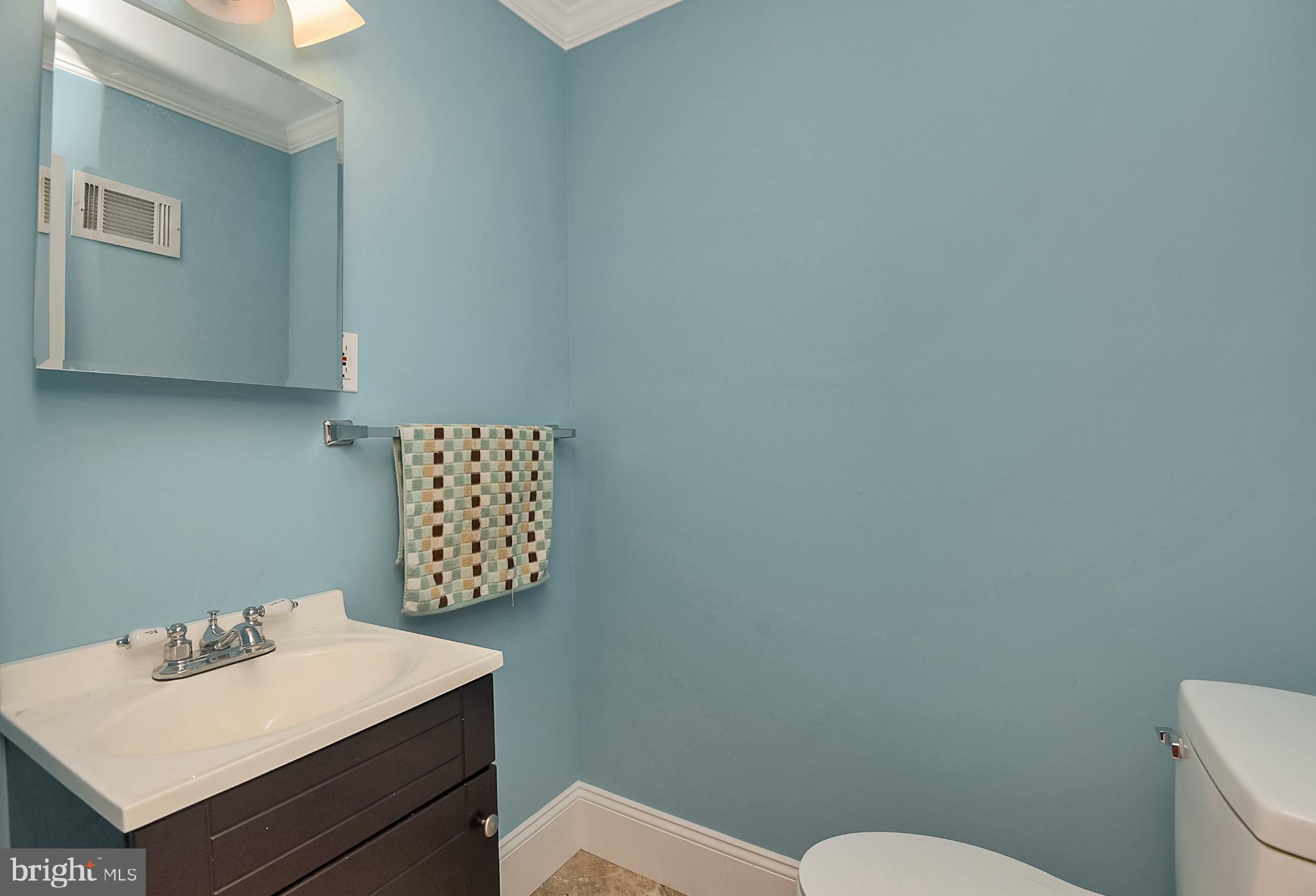 15 Constance Drive Hamilton, NJ 08620 - Photo 22 of 29 a bathroom with a toilet a sink and mirror