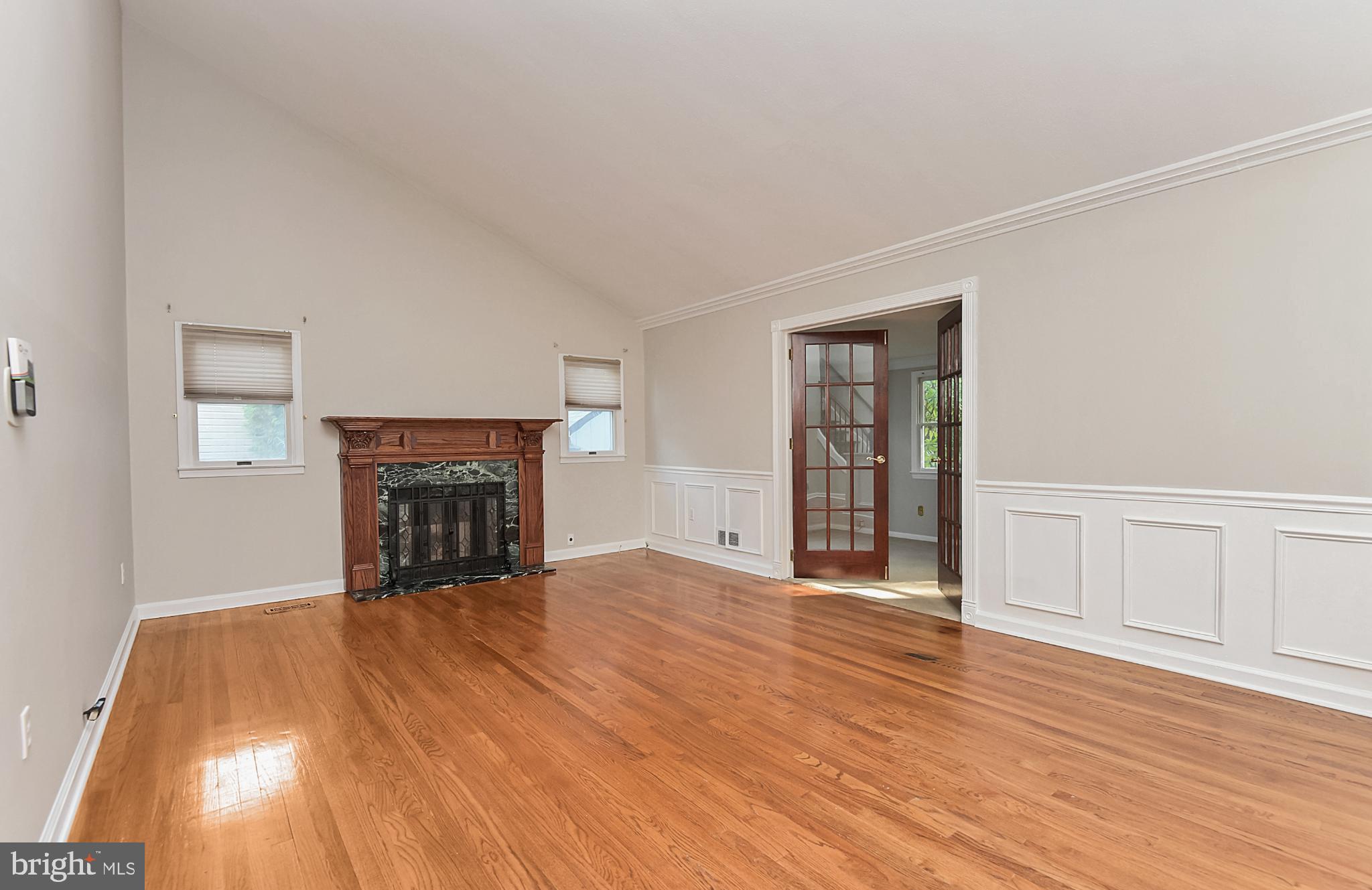 15 Constance Drive Hamilton, NJ 08620 - Photo 5 of 29 an empty room with wooden floor fireplace and windows