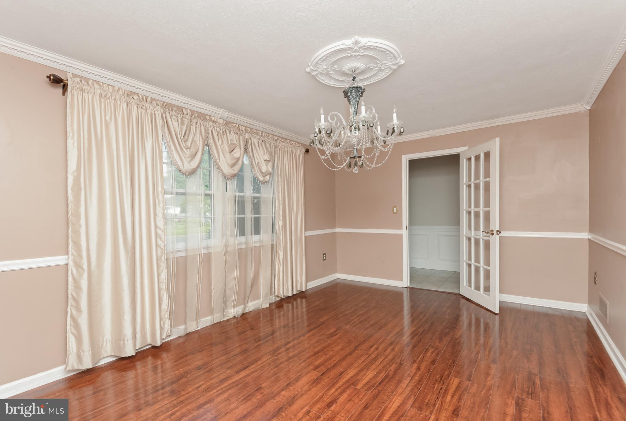 15 Constance Drive Hamilton, NJ 08620 - Photo 6 of 29 a view of a livingroom with wooden floor and chandelier