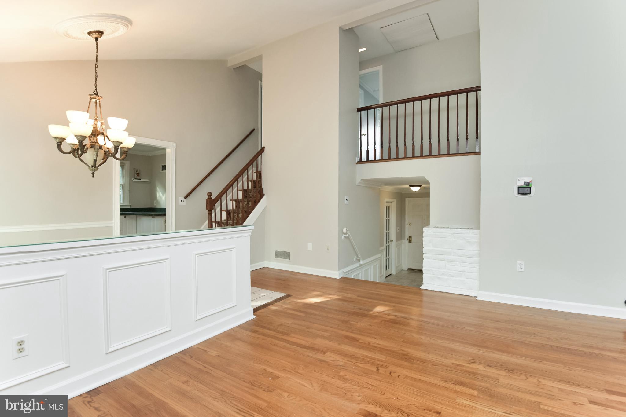 15 Constance Drive Hamilton, NJ 08620 - Photo 7 of 29 a view of a room with wooden floor and staircase