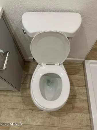 a bathroom with a toilet and a sink