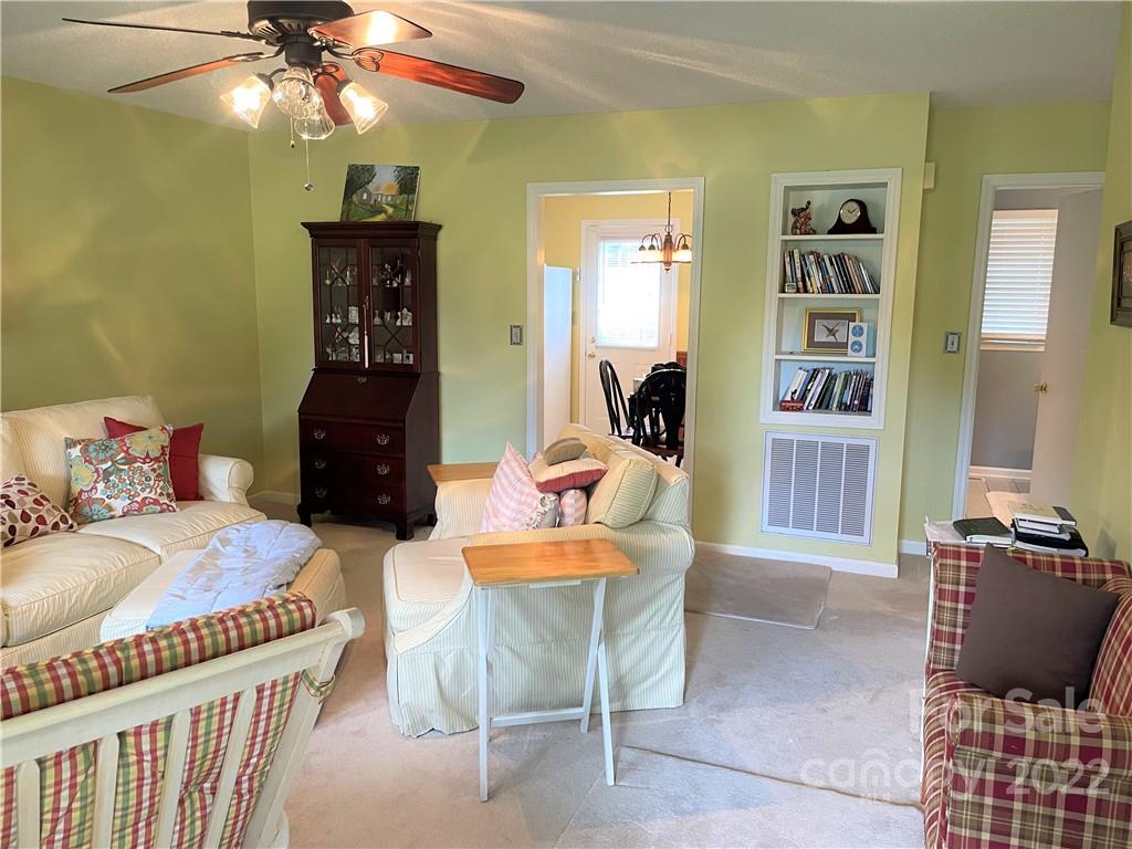 498 Whiteside Road Rutherfordton, NC 28139 - Photo 8 of 19 a bedroom with a bed and a chandelier