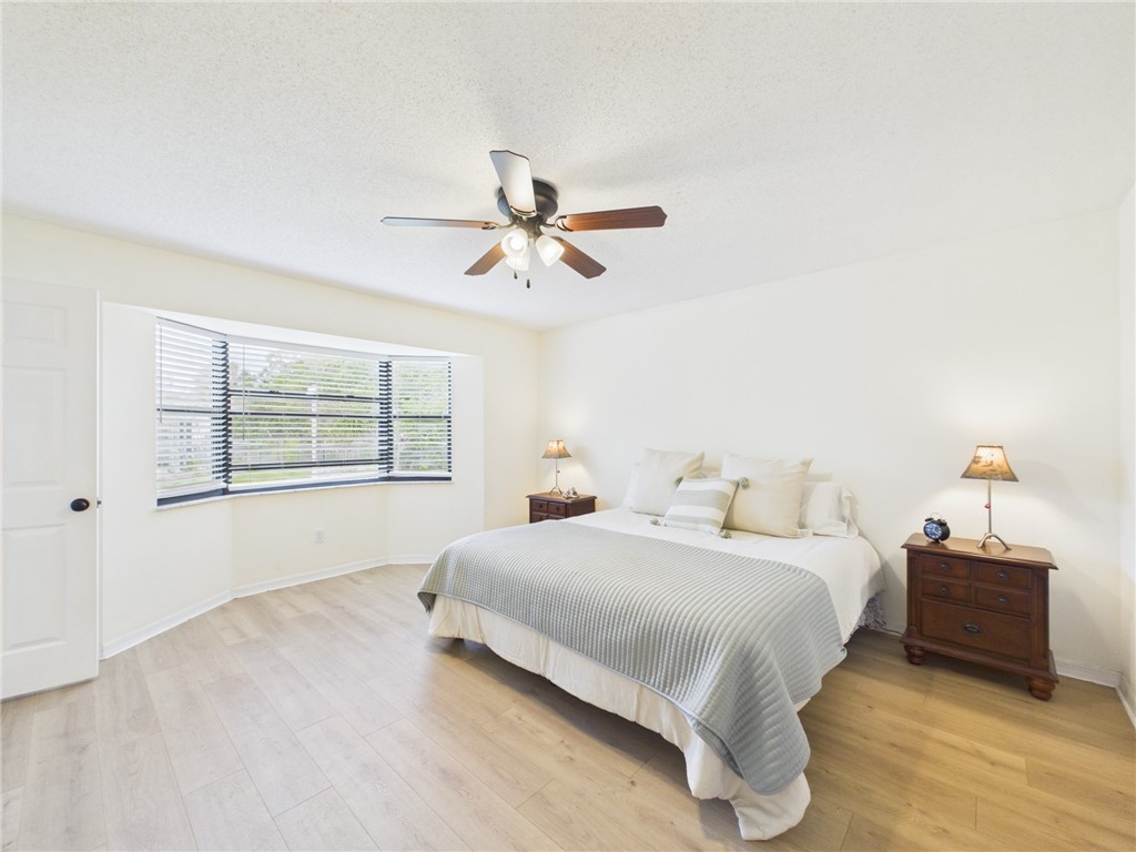 225 Midvale Terrace Sebastian, FL 32958 - Photo 16 of 25 a bedroom with a bed and a window