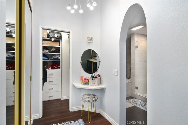 a bathroom with a sink a vanity and mirror