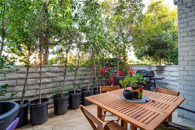 a view of a outdoor sitting area with furniture
