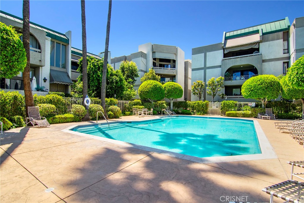 5305 White Oak Avenue, Unit E Encino, CA 91316 - Photo 22 of 26 a view of a street with potted plants and more windows