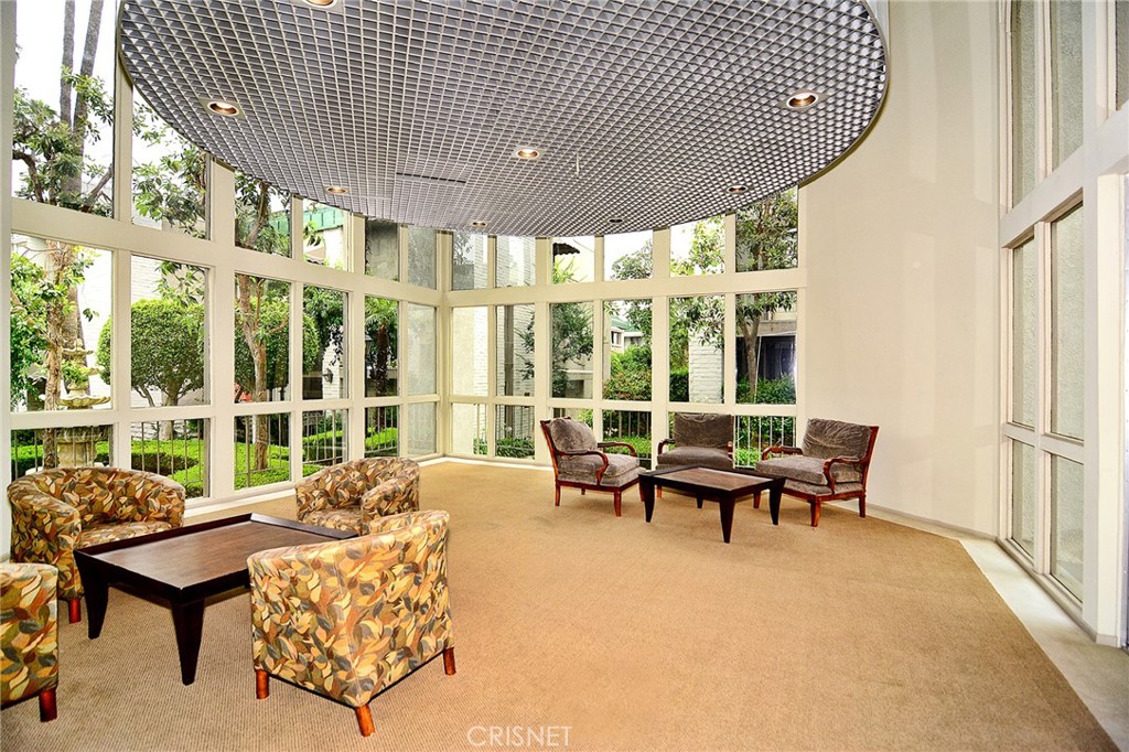 5305 White Oak Avenue, Unit E Encino, CA 91316 - Photo 23 of 26 a living room with furniture and a large window