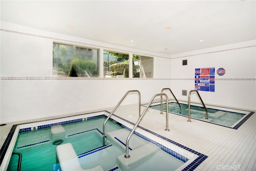 5305 White Oak Avenue, Unit E Encino, CA 91316 - Photo 24 of 26 a view of a living room and a floor to ceiling window
