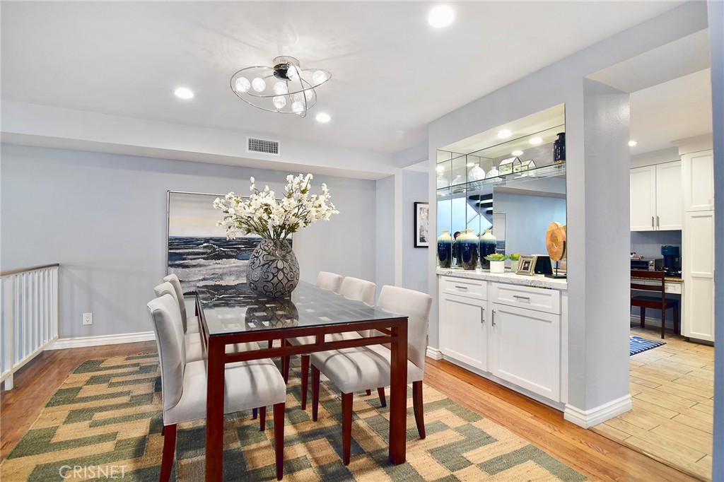 5305 White Oak Avenue, Unit E Encino, CA 91316 - Photo 6 of 26 a dining room filled chandelier and wooden floor