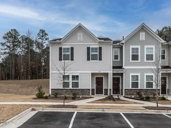 a front view of a house with yard