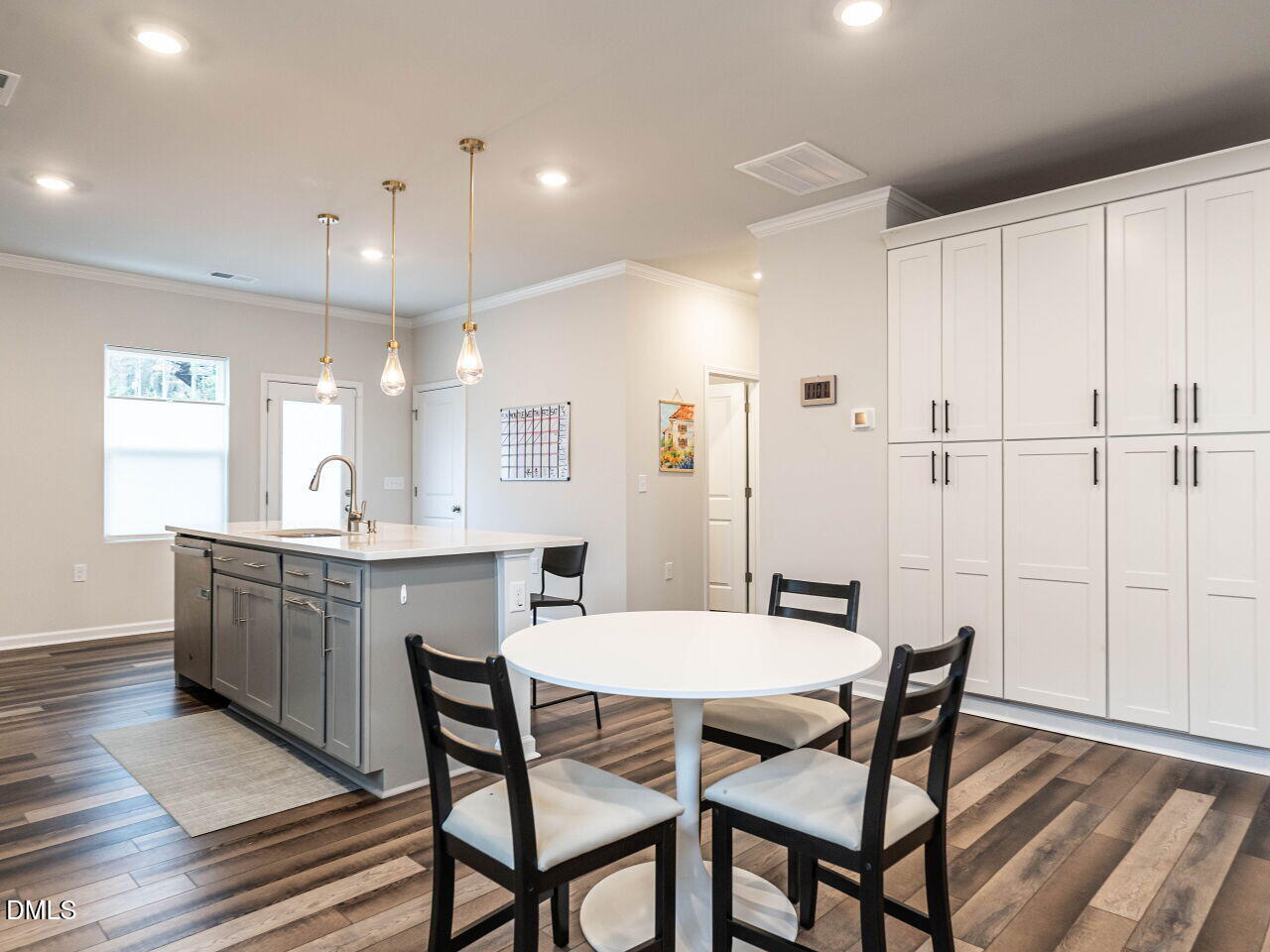 2456 Tonoloway Drive Raleigh, NC 27610 - Photo 12 of 45 a view of a dining room with furniture and wooden floor