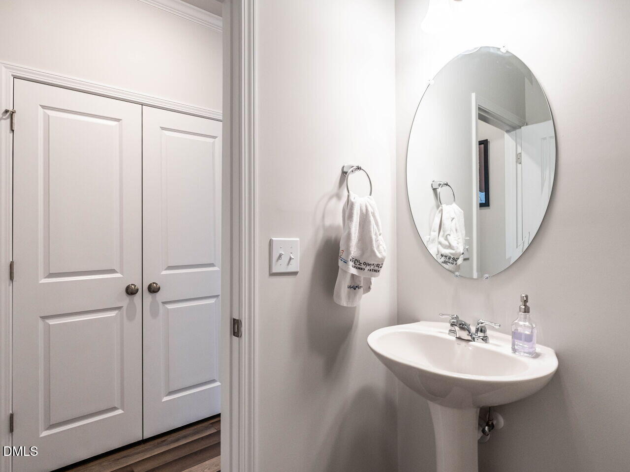 2456 Tonoloway Drive Raleigh, NC 27610 - Photo 21 of 45 a bathroom with a sink a mirror and a toilet