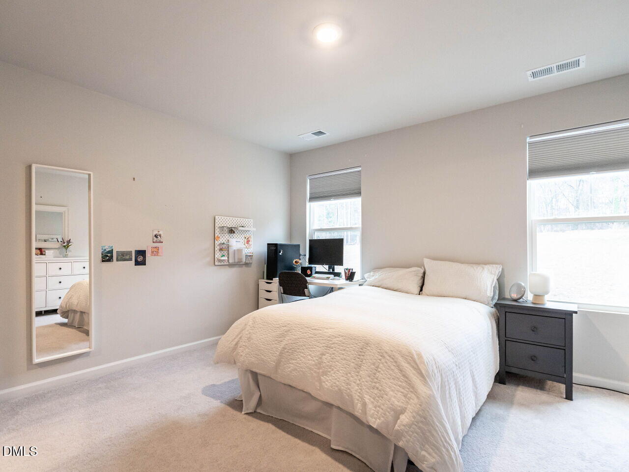 2456 Tonoloway Drive Raleigh, NC 27610 - Photo 23 of 45 a bedroom with a bed and a cabinets