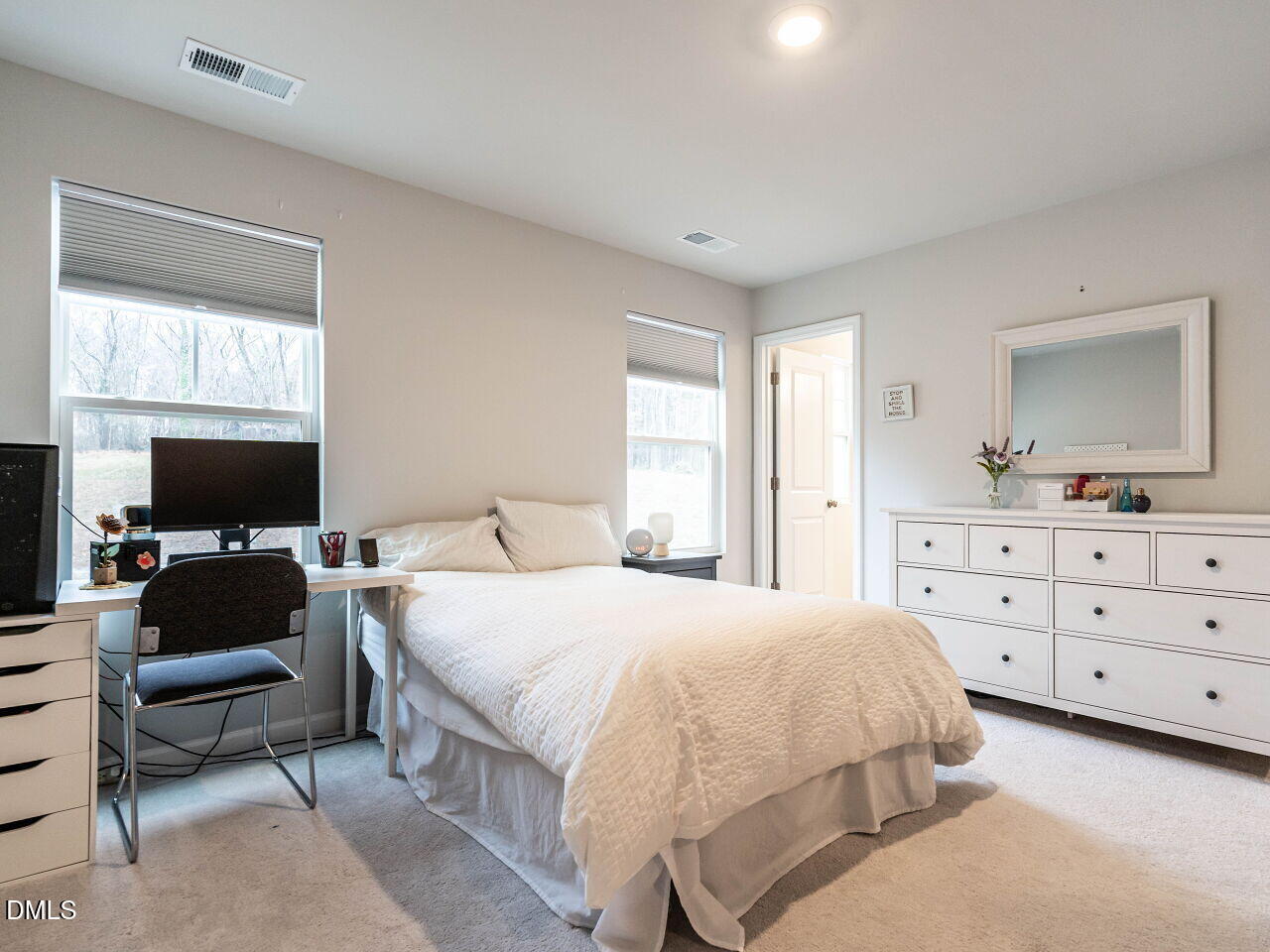 2456 Tonoloway Drive Raleigh, NC 27610 - Photo 24 of 45 a bedroom with a bed and a flat screen tv