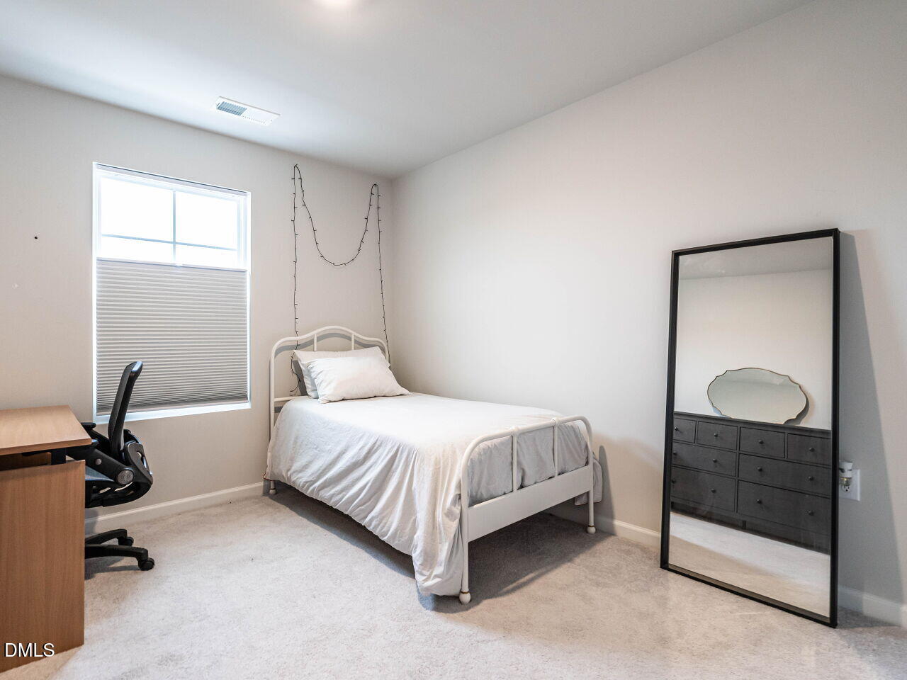 2456 Tonoloway Drive Raleigh, NC 27610 - Photo 30 of 45 a bedroom with a bed and a dresser