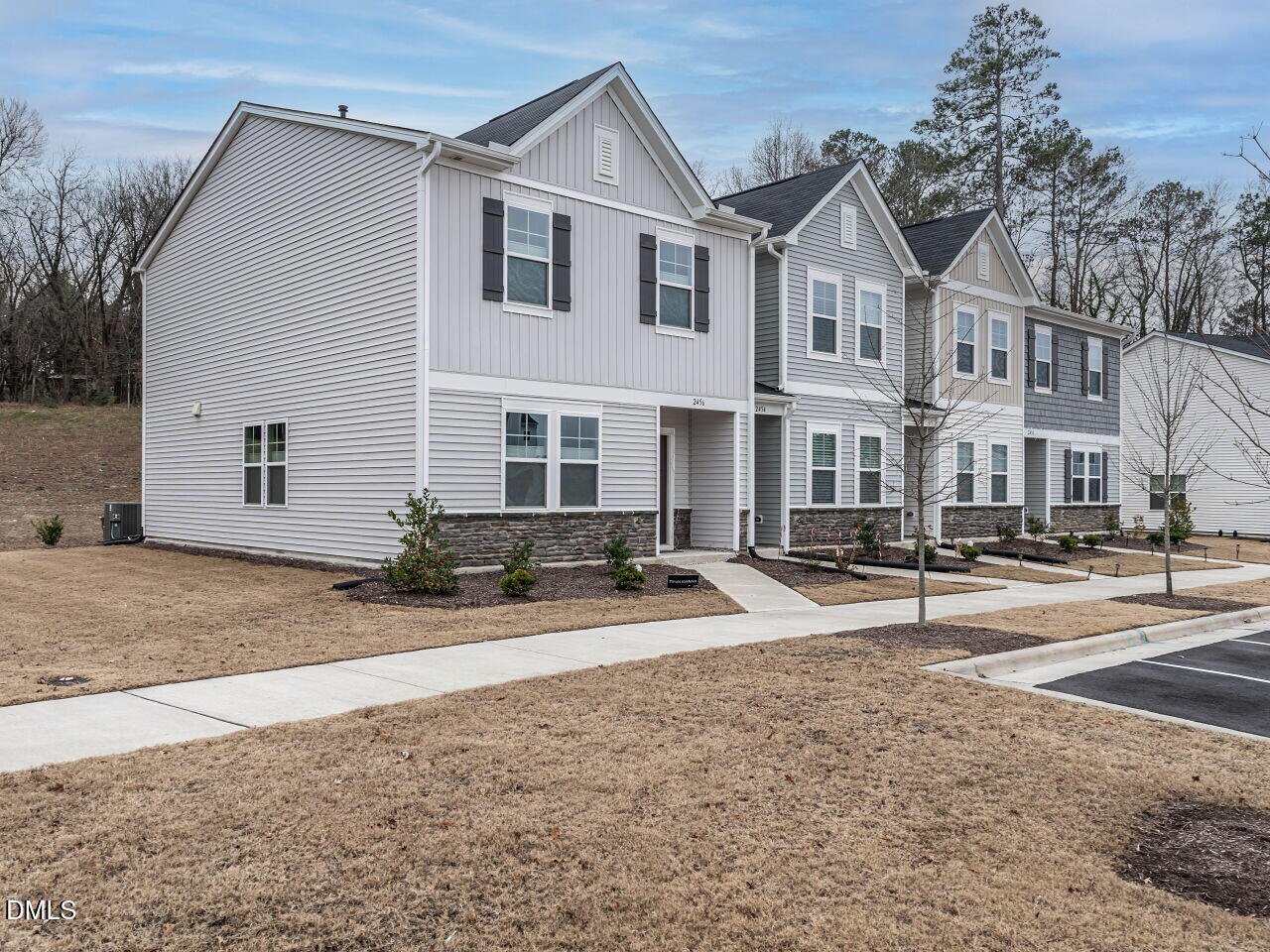 2456 Tonoloway Drive Raleigh, NC 27610 - Photo 3 of 45 a view of a white house with a yard and plants