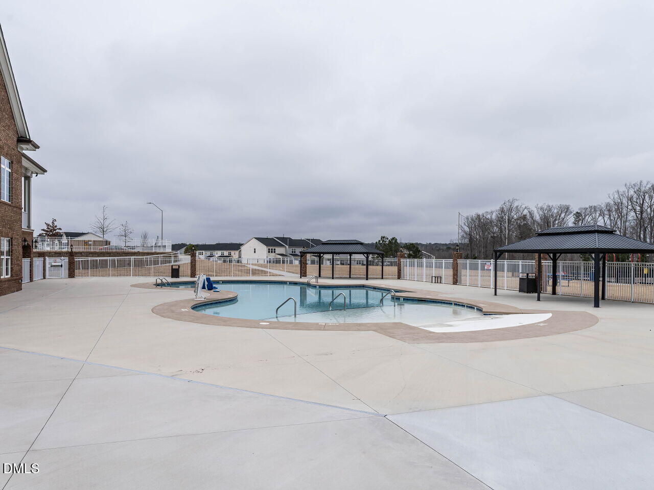 2456 Tonoloway Drive Raleigh, NC 27610 - Photo 42 of 45 a view of a swimming pool and an outdoor seating