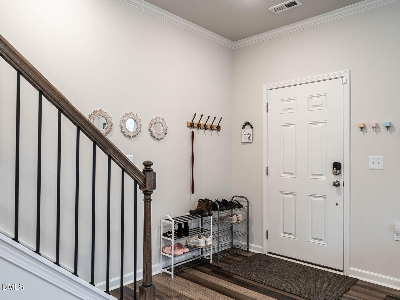 2456 Tonoloway Drive Raleigh, NC 27610 - Photo 5 of 45 a view of a livingroom with wooden floor and stairs