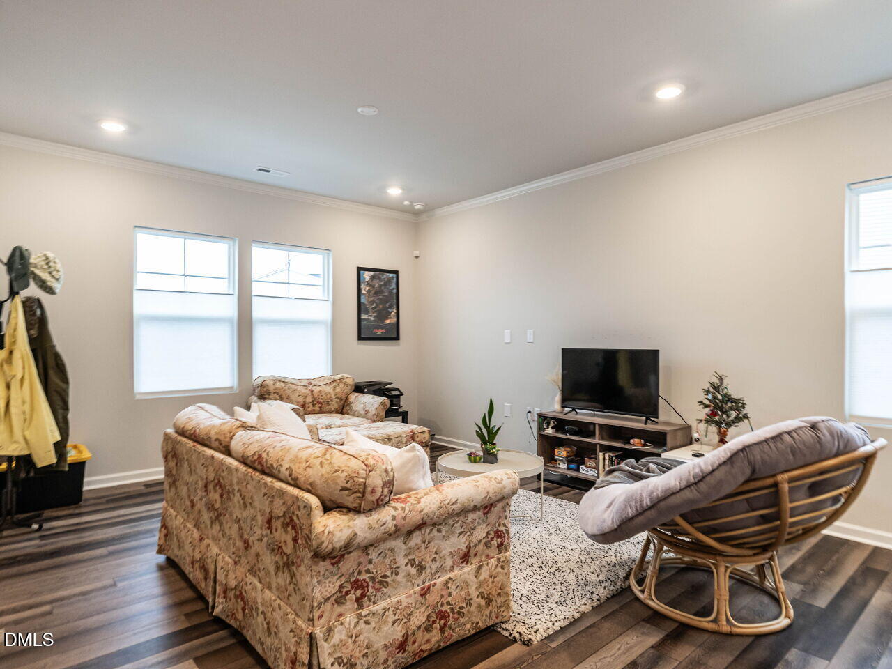 2456 Tonoloway Drive Raleigh, NC 27610 - Photo 7 of 45 a living room with furniture and a flat screen tv