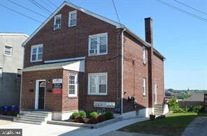 109 7th Street, Unit 3 Bridgeport, PA 19405 - Photo 2 of 11 a front view of a house with garden