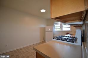 109 7th Street, Unit 3 Bridgeport, PA 19405 - Photo 6 of 11 a view of a livingroom with wooden floor and kitchen view