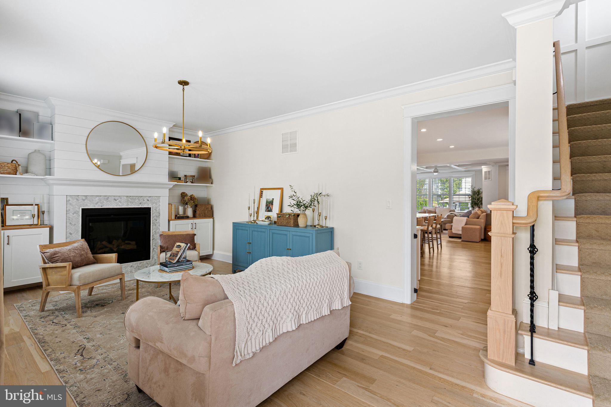305 Grove Street Haddonfield, NJ 08033 - Photo 11 of 45 a living room with furniture a fireplace and a floor to ceiling window
