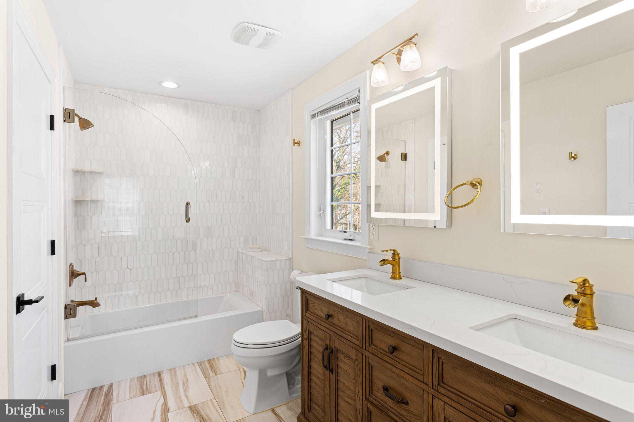 305 Grove Street Haddonfield, NJ 08033 - Photo 24 of 45 a bathroom with a sink a toilet a tub and shower