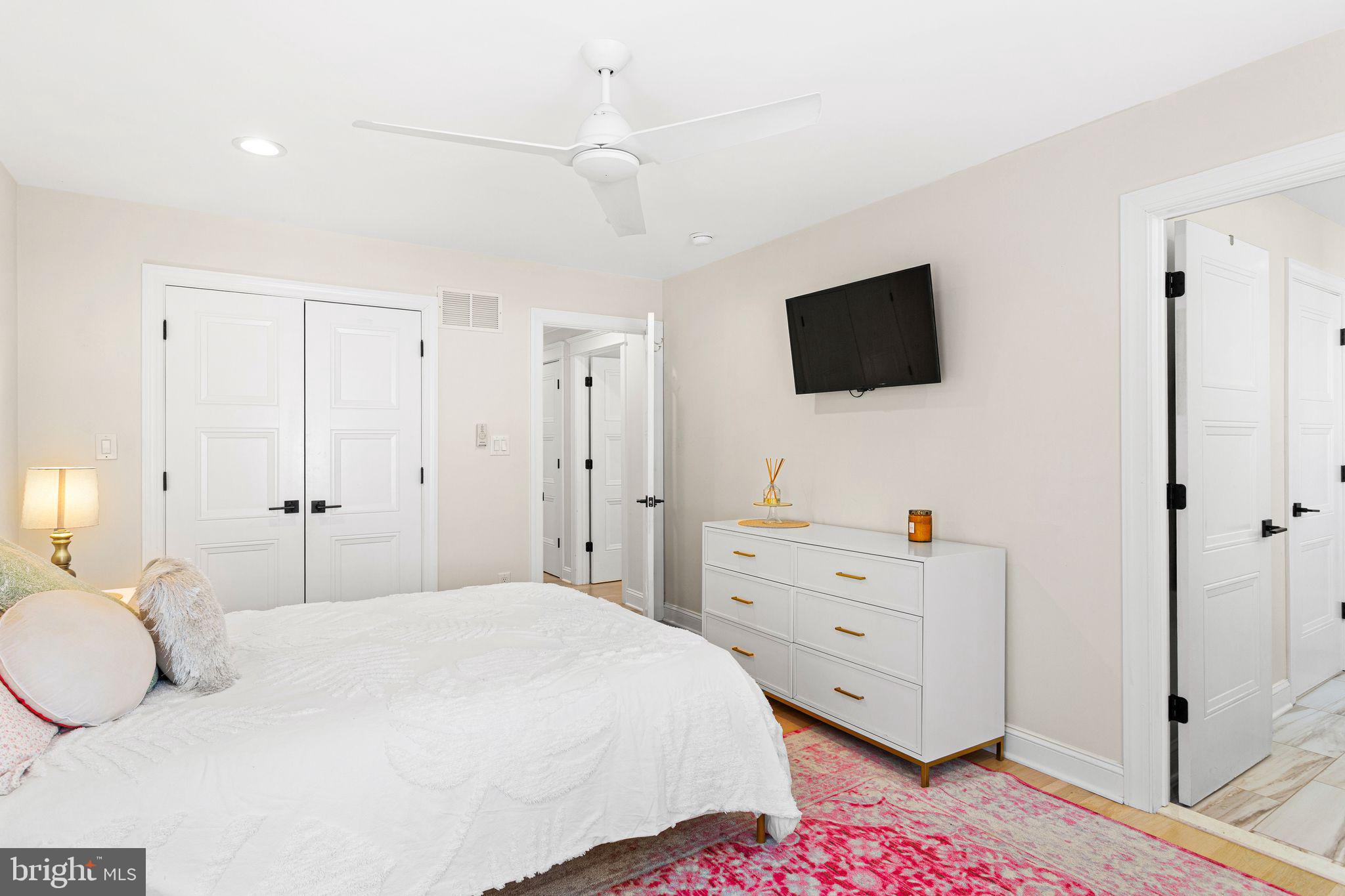 305 Grove Street Haddonfield, NJ 08033 - Photo 26 of 45 a bedroom with a bed and a flat screen tv