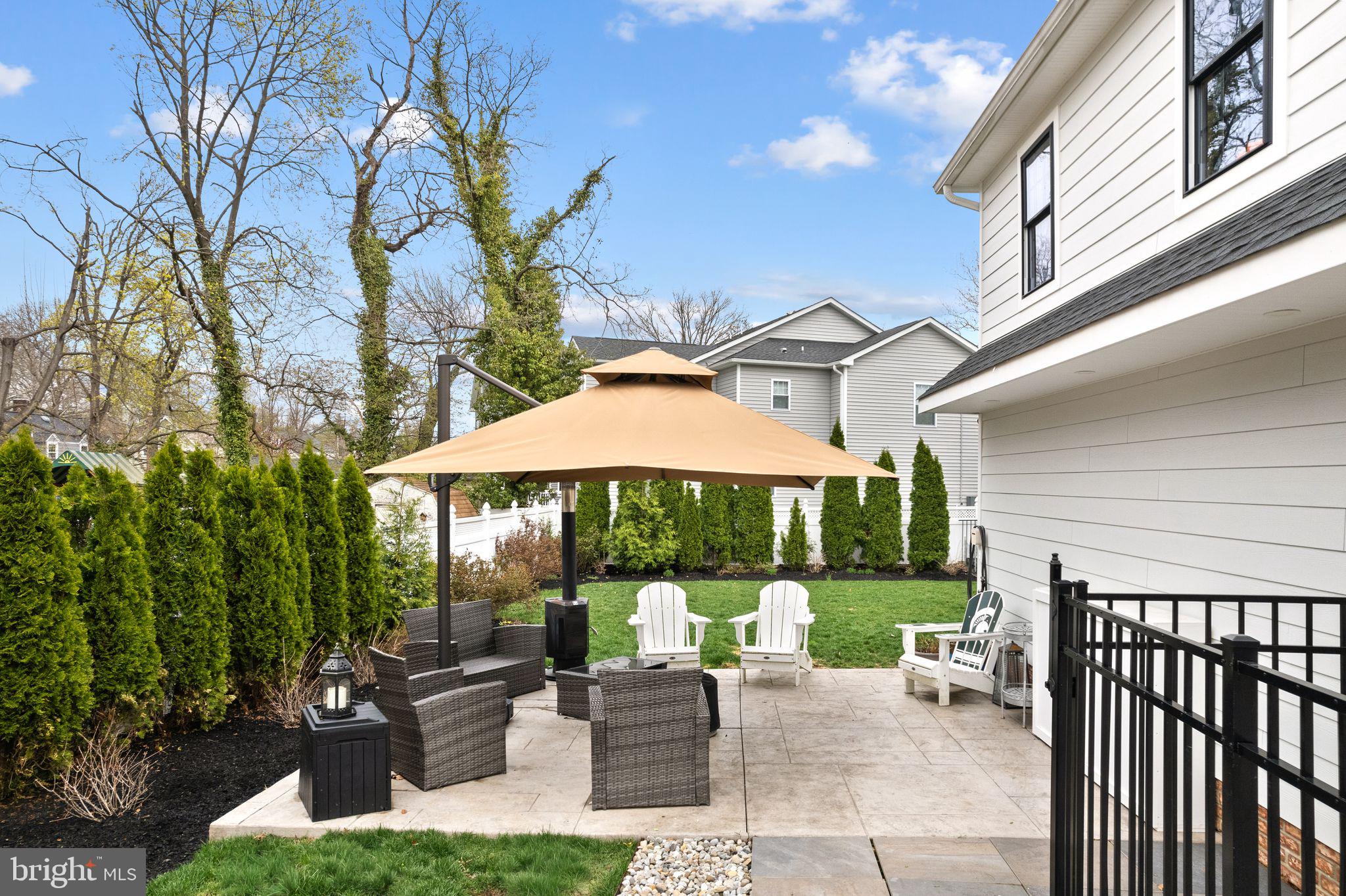 305 Grove Street Haddonfield, NJ 08033 - Photo 40 of 45 a view of a patio with a table and chairs under an umbrella