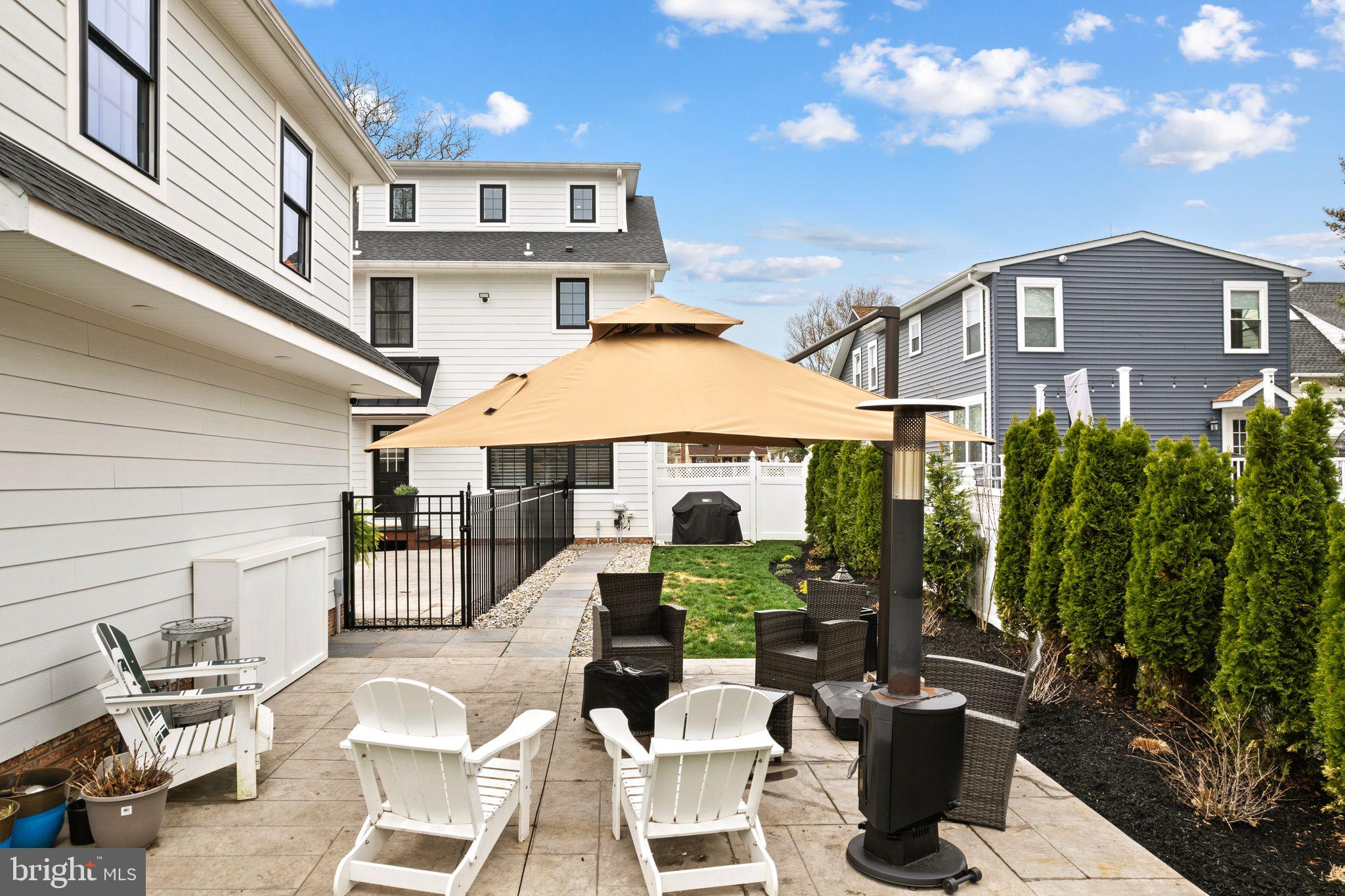 305 Grove Street Haddonfield, NJ 08033 - Photo 42 of 45 a view of a patio with table and chairs potted plants