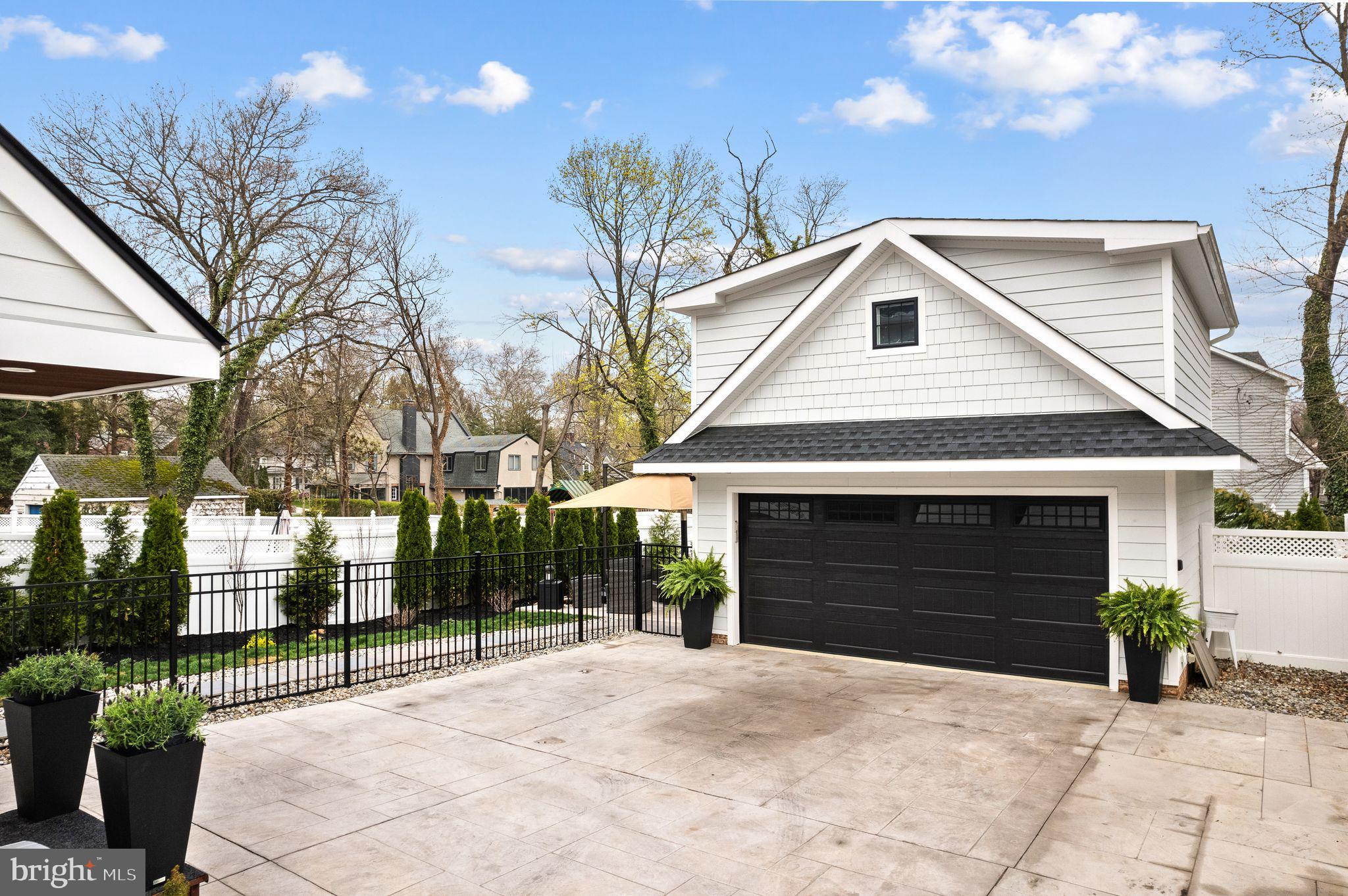 305 Grove Street Haddonfield, NJ 08033 - Photo 44 of 45 a front view of a house with a yard and garage