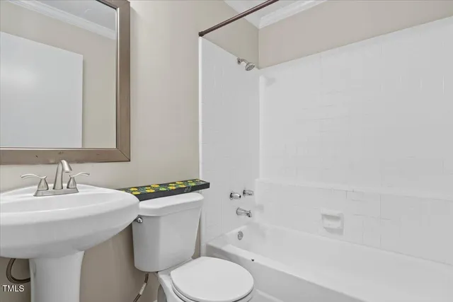 a bathroom with a sink toilet and a bathtub