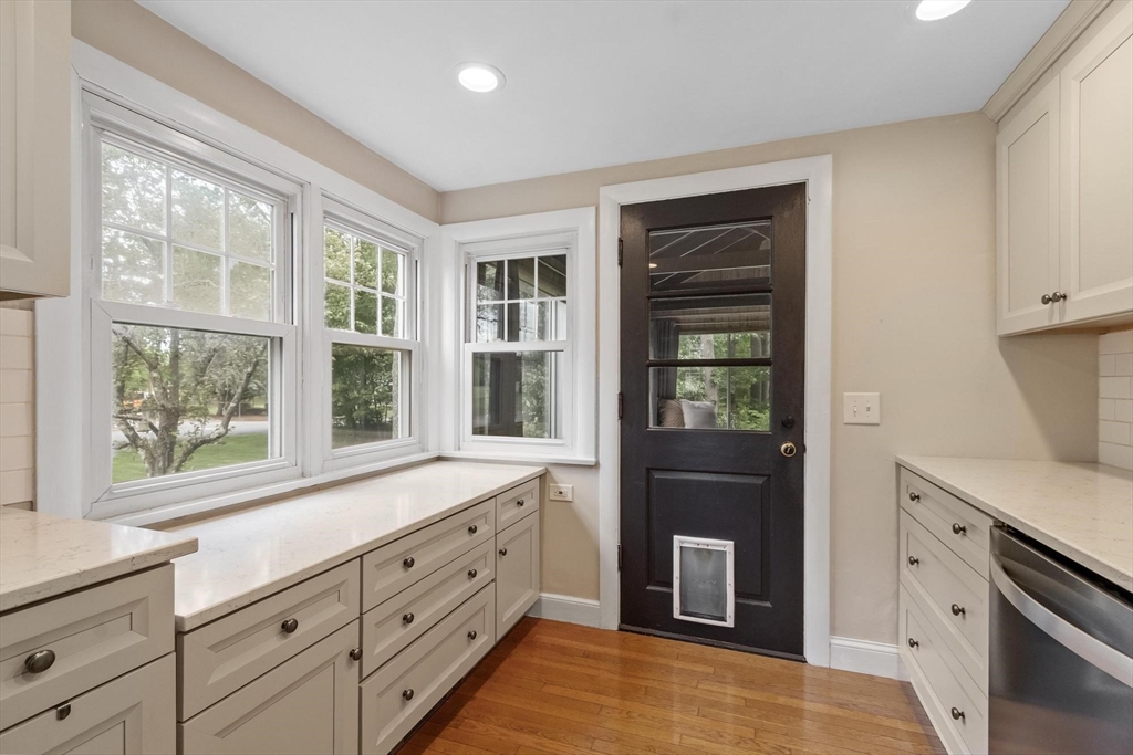 167 Gates Pond Road Berlin, MA 01503 - Photo 14 of 32 a kitchen with granite countertop a refrigerator and a sink